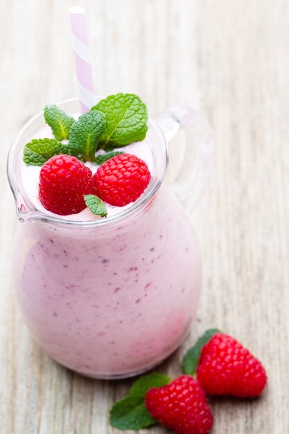 Raspberry milk shake with mint decor.