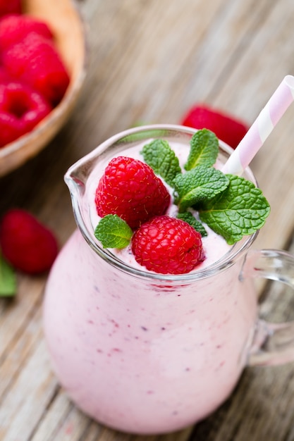 Raspberry milk shake with mint decor.