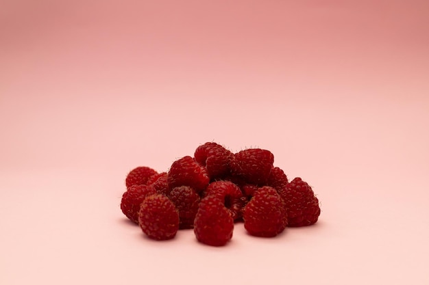 Raspberry on a pink background