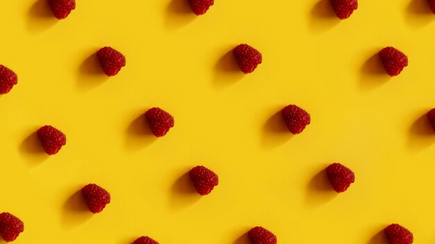 Raspberry rows on a yellow.