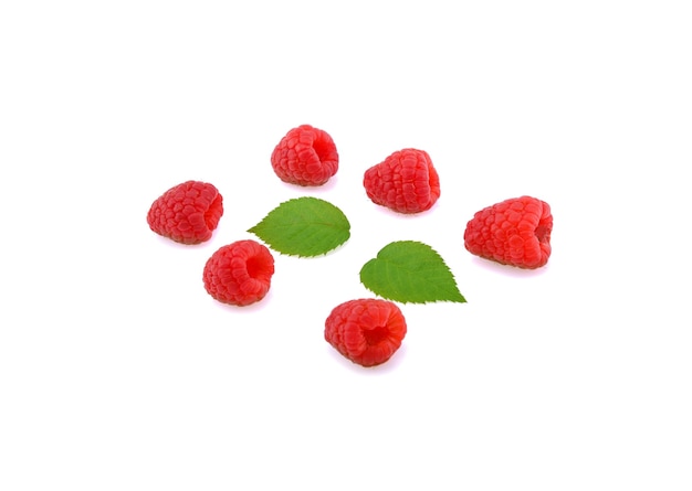 Raspberry with leaves isolated on white.