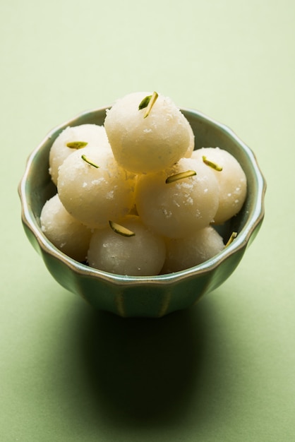 Rassgulla or Rosogolla made from ball shaped dumplings of chhena and semolina dough, cooked in light syrup made of sugar. Popular in west bengal and Assam