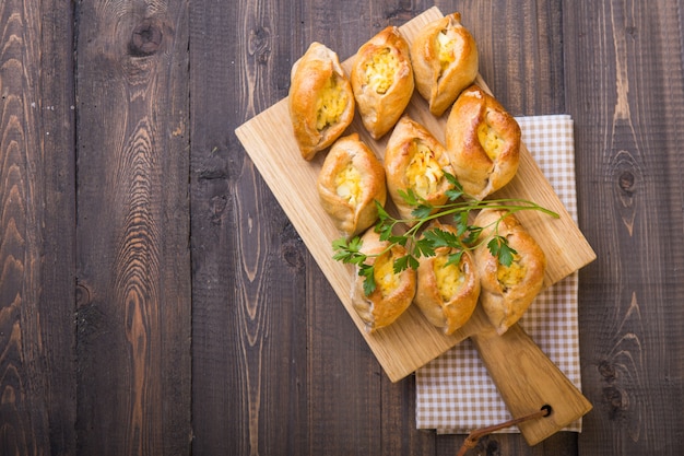 Rasstegai pie with fish filling and rice , egg. Traditional meal of Russian cuisine.