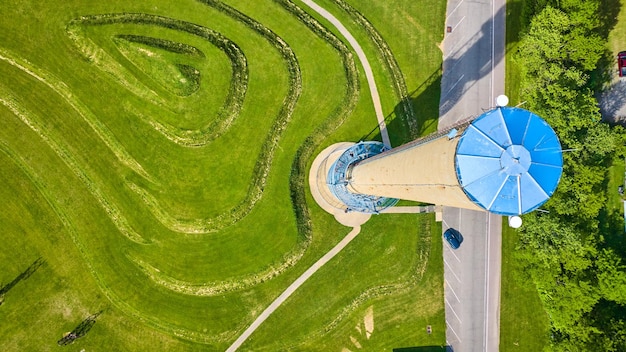 Rastin Observation Tower with green grass tiered hills aerial