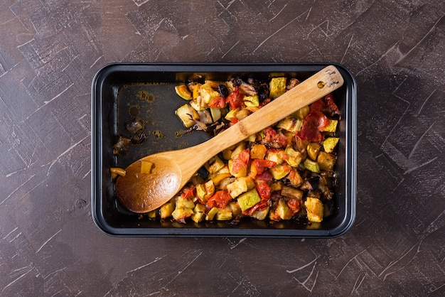 Ratatouille in the form of baking on a dark background.