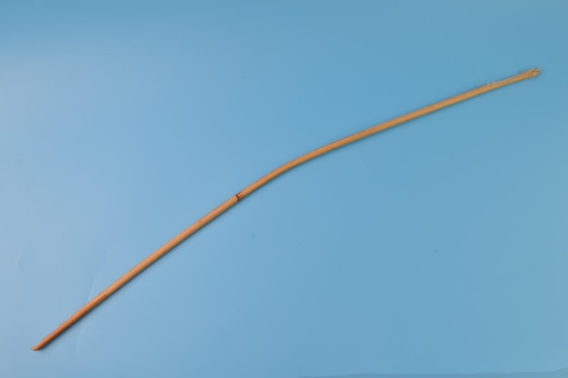 Rattan cane sticks isolated on a blue background