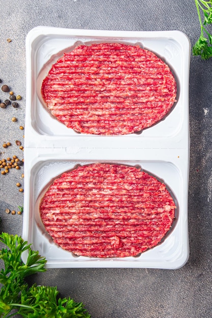 rauw rundvlees kotelet hamburger vers gerecht gezonde maaltijd eten snack op tafel kopieer ruimte voedsel achtergrond