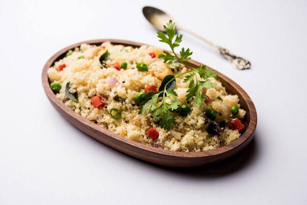 Rava Upma or Uppuma - south indian breakfast served in a bowl. selective focus