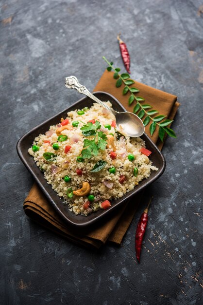 Rava Upma or Uppuma - south indian breakfast served in a bowl. selective focus