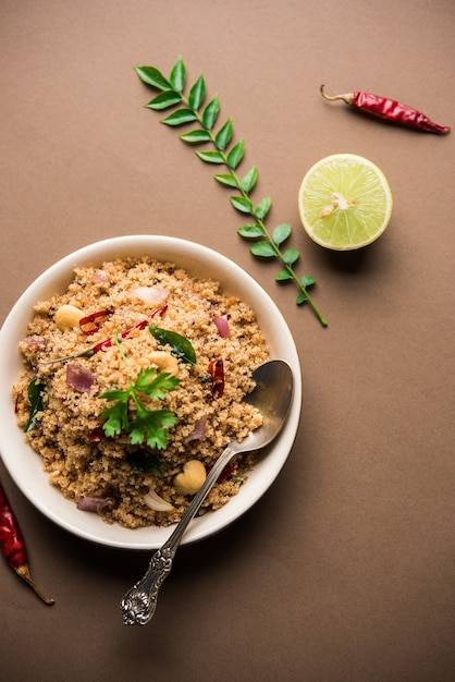 Rava Upma or Uppuma - south indian breakfast served in a bowl. selective focus