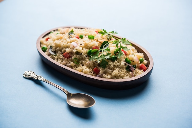 Rava Upma or Uppuma - south indian breakfast served in a bowl. selective focus