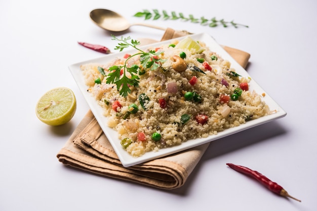 Rava Upma or Uppuma - south indian breakfast served in a bowl. selective focus