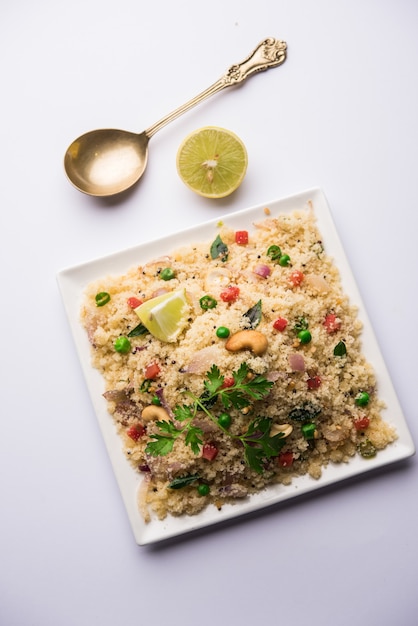 Rava Upma or Uppuma - south indian breakfast served in a bowl. selective focus