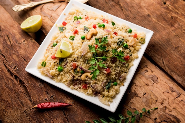 Rava Upma or Uppuma - south indian breakfast served in a bowl. selective focus