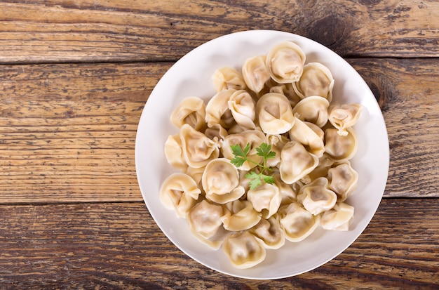 ravioli or dumplings on wooden table