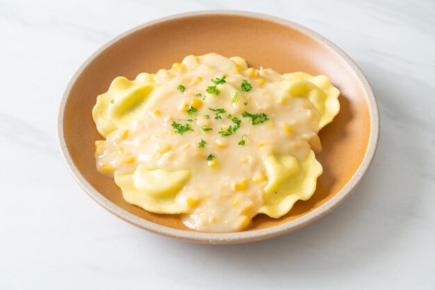 Ravioli pasta with corn cheese sauce