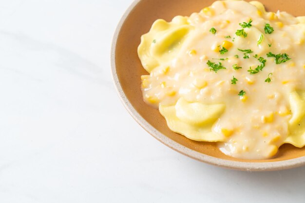 Ravioli pasta with corn cheese sauce