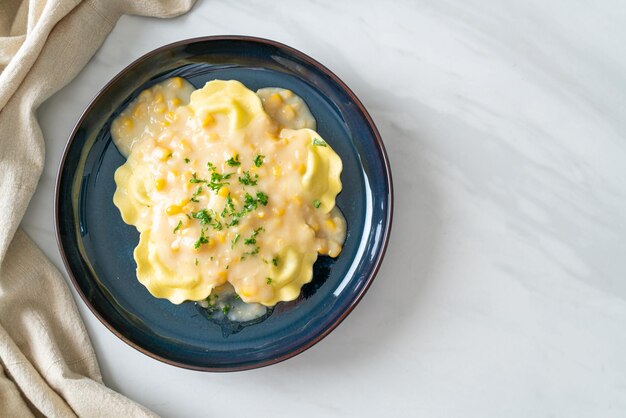 Ravioli pasta with corn cheese sauce