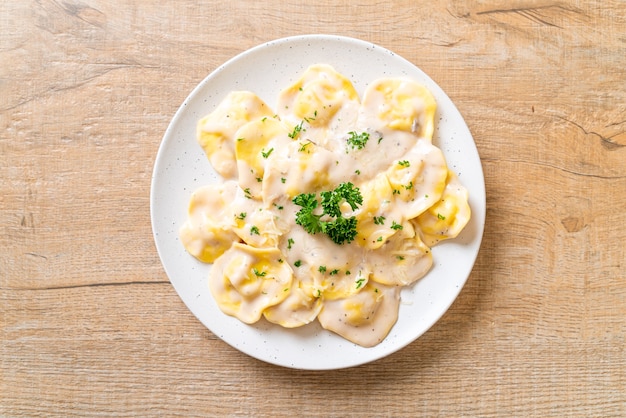 ravioli pasta with mushroom cream sauce and cheese