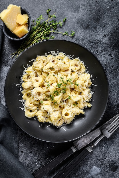 Ravioli pasta with parmesan cheese in a pan