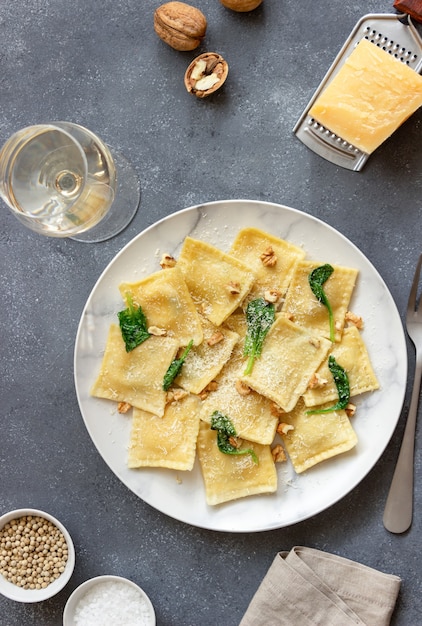 Ravioli with ricotta cheese, spinach and nuts. Healthy eating. Vegetarian food. Italian cuisine.