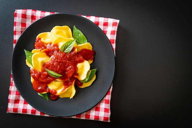 Ravioli with tomato sauce and basil - Italian food style