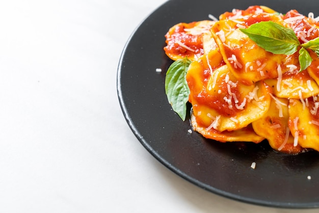 Ravioli with tomato sauce and basil