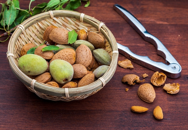 Raw almonds, peeled, with peel, skin (almendrucos) and almond leaves.