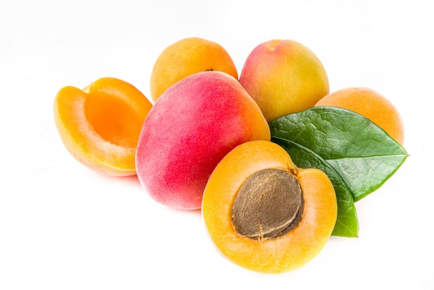 Raw apricots isolated on white