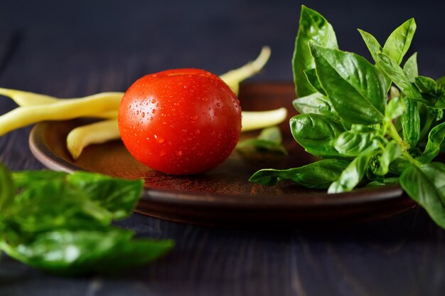 Raw asparagusFresh basil and red tomatoes