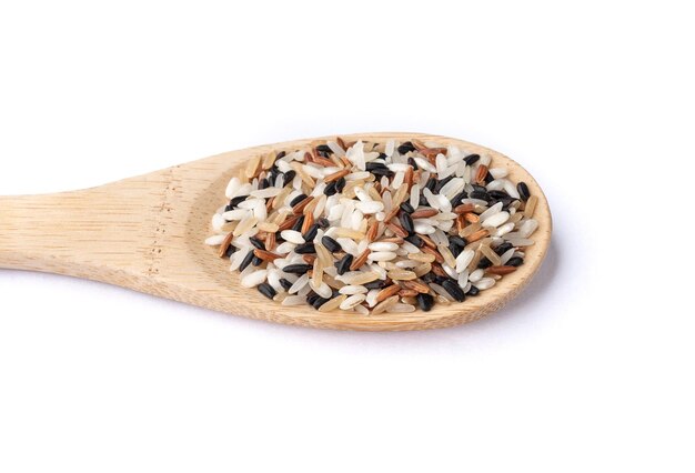 Raw assorted rice in a spoon isolated over white background