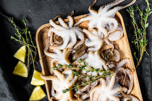 Raw baby octopus on the table