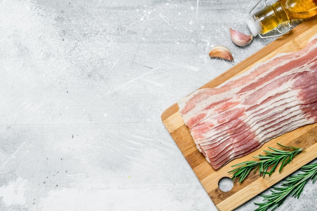 Raw bacon with herbs and spices
