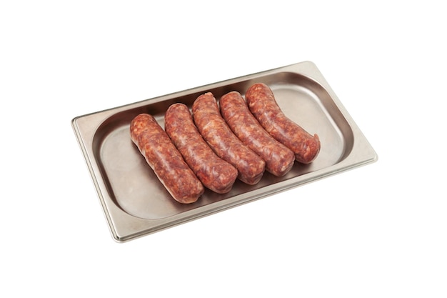 Raw barbecue sausages products on metal tray. Frankfurters. Natural meat processed foods.