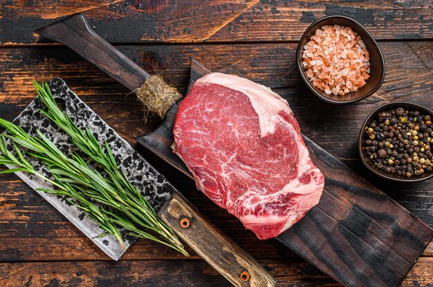 Raw beef Club steak on a cutting board