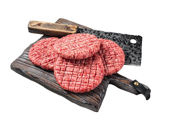 Photo raw beef meat burger patties on butcher wooden board with meat cleaver isolated white background