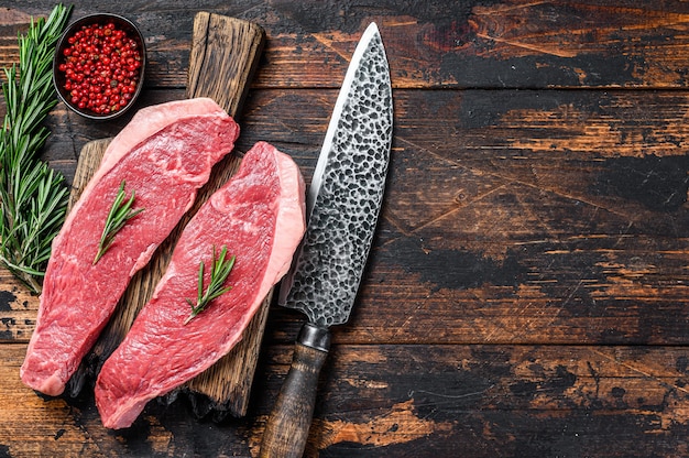 Raw beef meat cap sirloin steak on a cutting board