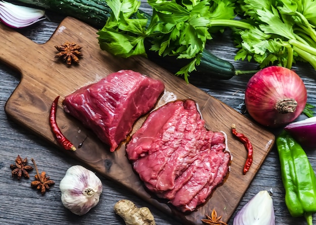 Raw beef meat on a cutting board