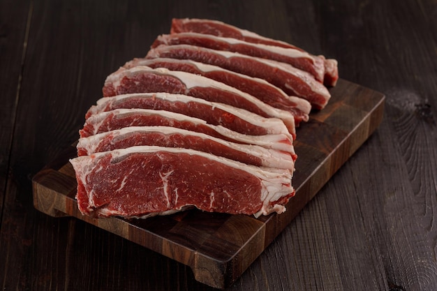 Raw beef meat on a cutting board