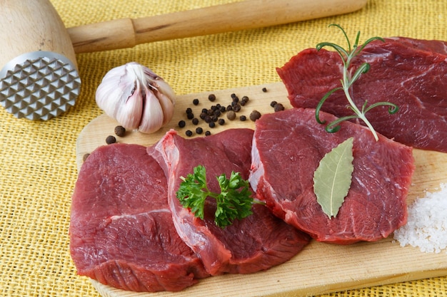 Raw beef meat on a cutting board