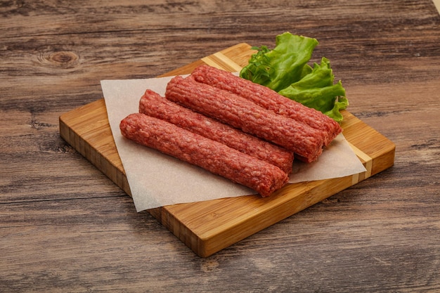 Raw beef sausages with spices