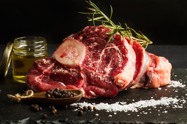 Raw beef shank slices on a black slab