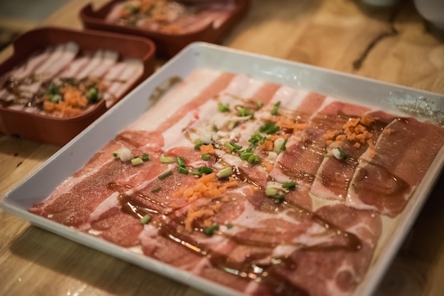 Raw beef slice for barbecue or Japanese style yakiniku