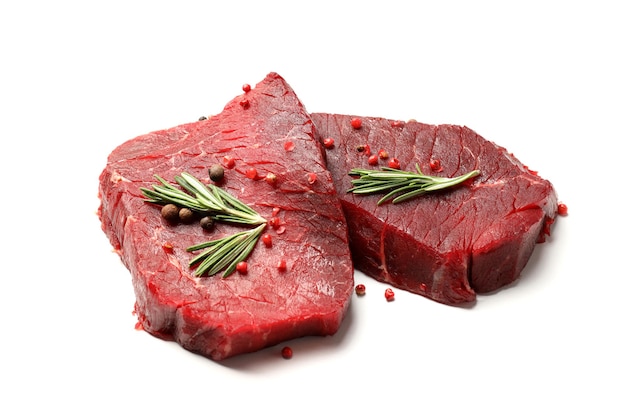 Raw beef steaks isolated on white background