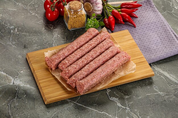 Raw beef uncooked kebab sausage for grill