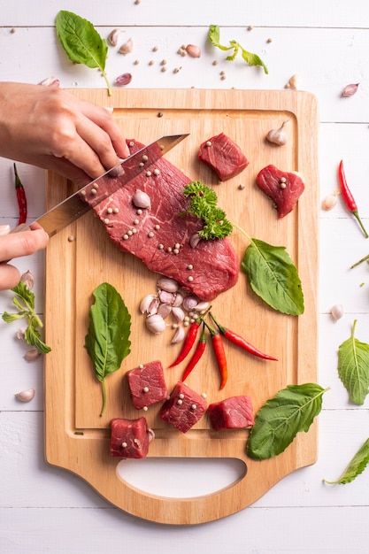 Raw beef on white wood background 