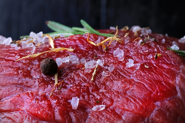 Raw beef with rosemary and spices