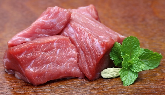 Raw beef on wooden surface