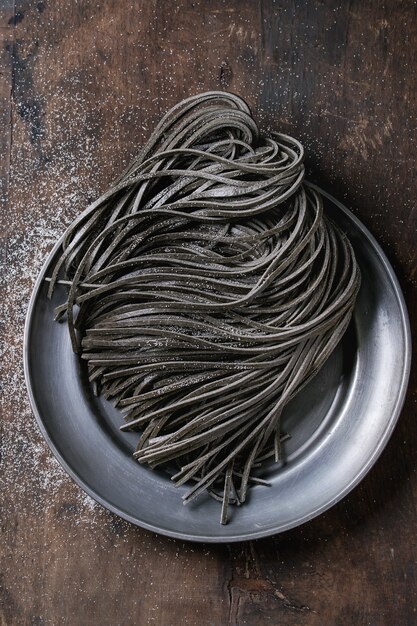 Raw black spaghetti pasta