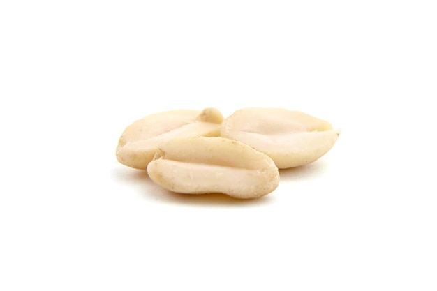Raw blanched peanuts isolated on white background
